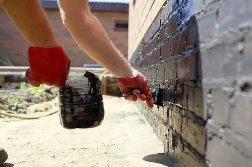 Dark brown door with gold accents