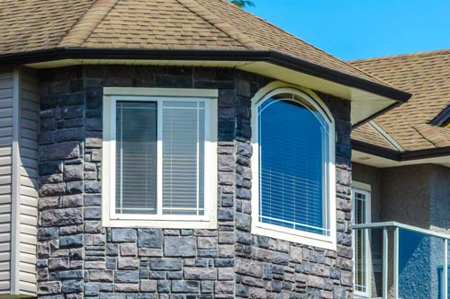 Gothic tower style house with white window.